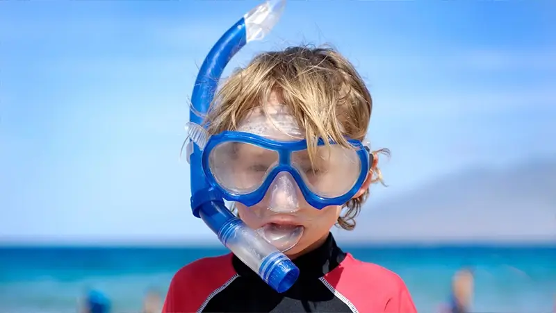 child having fun in maui hawaii
